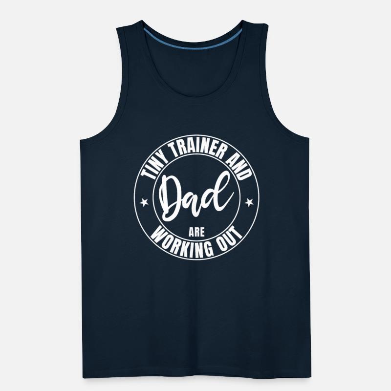 Dad and baby tiny trainer are working out in gym